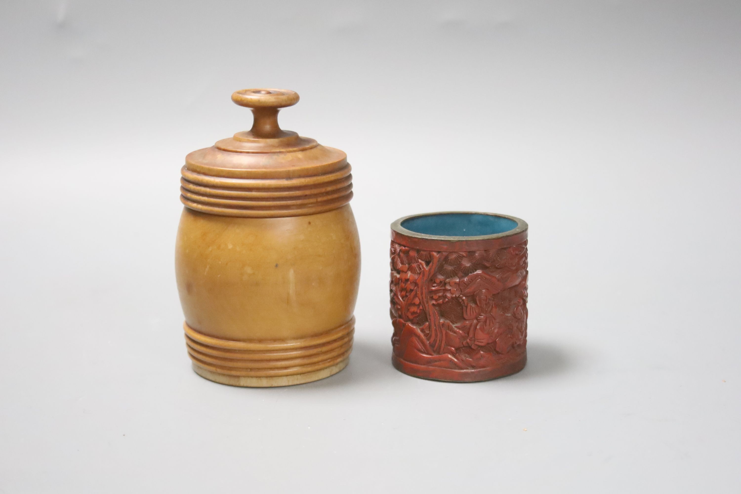 A Chinese cinnabar lacquer cigarette box and cover, 10cm and a similar match holder and a Dutch treen match holder